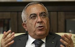 Palestinian Authority Prime Minister Salaam Fayyad speaks during an interview with The Associated Press in the West Bank city of Ramallah, 2011 (photo credit: AP/Majdi Mohammed, File)