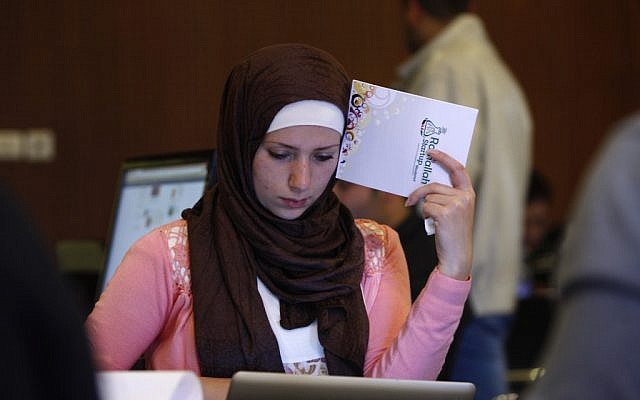 A Palestinian programmer attends a Ramallah Startup Weekend workshop on April 6. (photo credit: AP/Majdi Mohammed)
