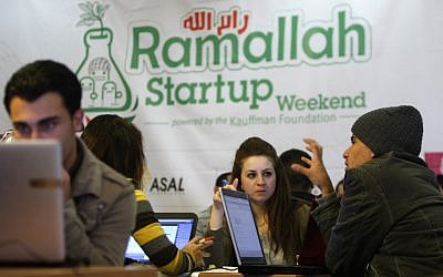 Palestinian programmers attend a Ramallah Startup Weekend workshop on April 5 (photo credit:AP/Majdi Mohammed)