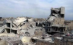 Destroyed homes in a government airstrike and shelling, in the neighborhood of Marjeh in the northern city of Aleppo, Syria, Thursday, April 11, 2013. (photo credit: AP/Aleppo Media Center)