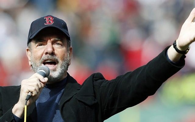This April 20, 2013 file photo shows Neil Diamond singing 'Sweet Caroline' in the eighth inning of a baseball game between the Boston Red Sox and the Kansas City Royals in Boston. (photo credit: AP Photo/Michael Dwyer, file)
