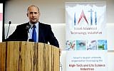 Economics Minister Naftali Bennett speaks at the Multinational R&D forum sponsored by IATI on April 11 (Photo credit: Courtesy)