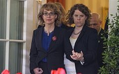Former congresswoman Gabrielle Giffords is helped as she arrives for a news conference in the Rose Garden of the White House, Wednesday, April 17. (photo credit: AP/Carolyn Kaster)