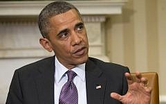 US President Barack Obama answers a question regarding the ongoing situation in Syria during his meeting with Jordan's King Abdullah II, in the Oval Office of the White House in Washington, Friday. (photo credit: AP Photo/Pablo Martinez Monsivais)