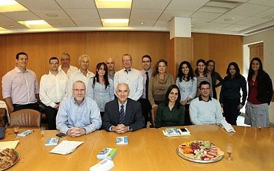 Members of the joint Finance Ministry-SwiftNess steering committee celebrating the completion of the SwiftNess website. Seated (left to right): Effi Kotek, President Ness Israel; Professor Oded Sarig; Lee Dagan; Victor Weiss, Finance Ministry (photo credit: Courtesy Ness Technologies)