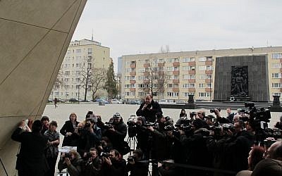 Poland's chief rabbi, Michael Schudrich, unveiling the mezuzah on the entrance to the Museum of the History of Polish Jews in April 2013. (photo credit: Ruth Ellen Gruber/JTA) Poland's chief rabbi, Michael Schudrich, unveiling the mezuzah on the entrance to the Museum of the History of Polish Jews in April 2013. (photo credit: Ruth Ellen Gruber/JTA)