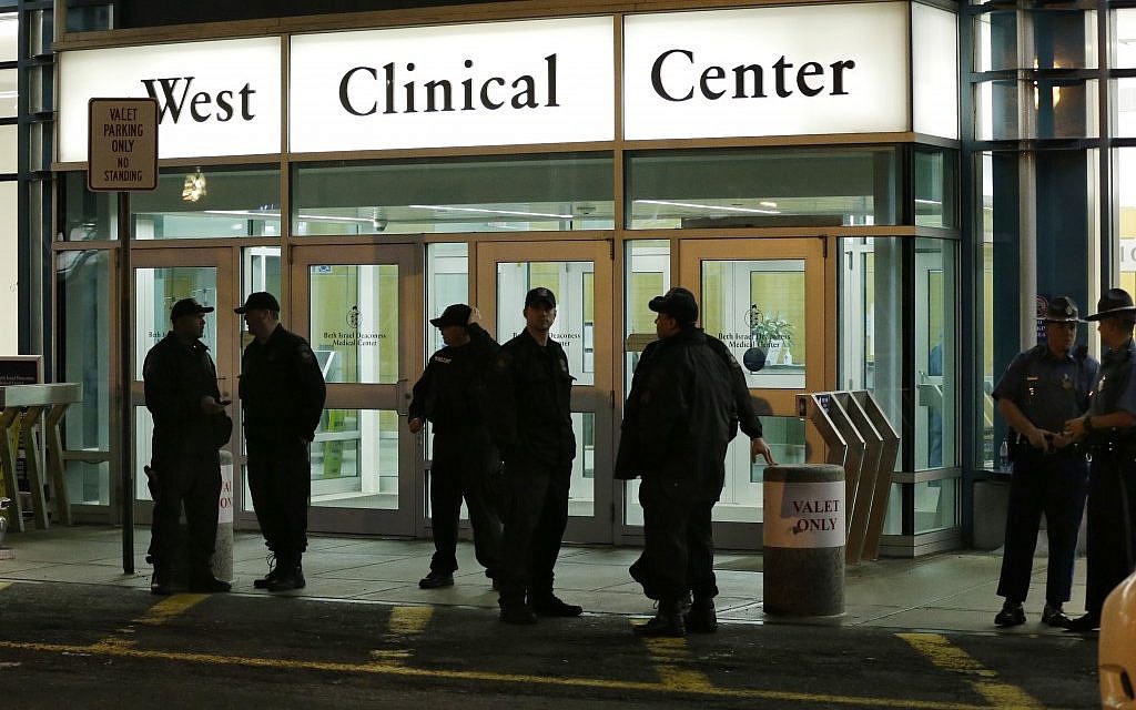 Police stand guard outside Beth Israel Deaconess Medical Center Friday, April 19, 2013 after an ambulance carrying Dzhokhar Tsarnaev, a19-year-old Massachusetts college student wanted in the Boston Marathon bombings, arrived (photo credit: AP/Elise Amendola) Police stand guard outside Beth Israel Deaconess Medical Center Friday, April 19, 2013 after an ambulance carrying Dzhokhar Tsarnaev, a19-year-old Massachusetts college student wanted in the Boston Marathon bombings, arrived (photo credit: AP/Elise Amendola)
