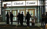 Police stand guard outside Beth Israel Deaconess Medical Center Friday, April 19, 2013 after an ambulance carrying Dzhokhar Tsarnaev, a19-year-old Massachusetts college student wanted in the Boston Marathon bombings, arrived (photo credit: AP/Elise Amendola)