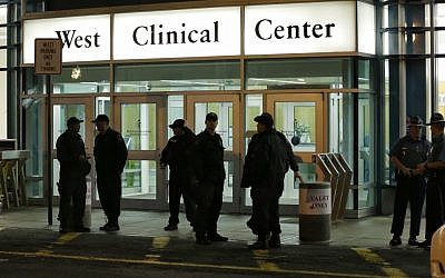 Police stand guard outside Beth Israel Deaconess Medical Center Friday, April 19, 2013 after an ambulance carrying Dzhokhar Tsarnaev, a19-year-old Massachusetts college student wanted in the Boston Marathon bombings, arrived (photo credit: AP/Elise Amendola)