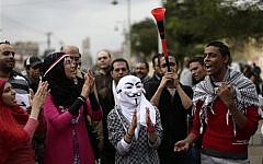 An illustrative photo of Egyptian protesters chanting anti Muslim Brotherhood slogans outside the presidential palace, in Cairo, Egypt, in December 2012. (photo credit: AP Photo/Hassan Ammar, File)