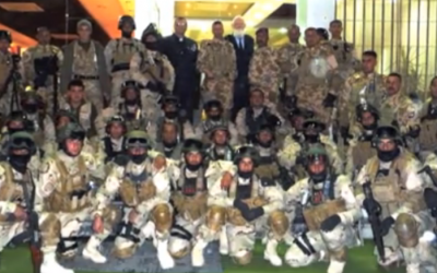 Canon White with (some of) his Iraqi army guards (YouTube screenshot)