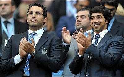 Sheikh Mansour bin Zayed Al Nahyan, right, attends a soccer match in England (photo credit: public domain)