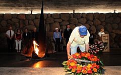 A Holocaust survivor lays a wreath in the Hall of Remembrance at the Yad Vashem Holocaust memorial in Jerusalem. September 20, 2012. (photo credit: Yoav Ari Dudkevitch/Flash90)