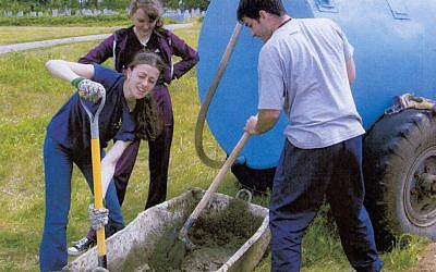 US college students preparing some cement as part of a restoration project for a Belarus Jewish cemetery, 2012. (photo credit: Restoration of Eastern European Jewish Cemeteries Foundation/JTA) US college students preparing some cement as part of a restoration project for a Belarus Jewish cemetery, 2012. (photo credit: Restoration of Eastern European Jewish Cemeteries Foundation/JTA)