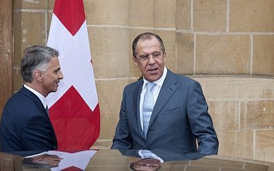 Russian Foreign Minister Sergey Lavrov, right, is welcomed by Switzerland's Federal Councillor and Foreign Minister Didier Burkhalter for a working visit in Neuchatel, Switzerland on Friday (photo credit: AP/Keystone/Sandro Campardo)