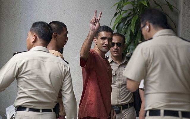 Iranian bombing suspect Mohammad Kharzei gestures upon arriving at the South Criminal Court in Bangkok, Thailand, on Friday. (photo credit: AP/Sakchai Lalit) Iranian bombing suspect Mohammad Kharzei gestures upon arriving at the South Criminal Court in Bangkok, Thailand, on Friday. (photo credit: AP/Sakchai Lalit)