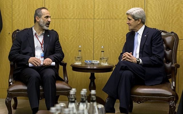 US Secretary of State John Kerry meets with Syrian opposition leader Moaz al-Khatib, left, Saturday, April 20, 2013, in Istanbul, Turkey. (photo credit: AP/Evan Vucci) US Secretary of State John Kerry meets with Syrian opposition leader Moaz al-Khatib, left, Saturday, April 20, 2013, in Istanbul, Turkey. (photo credit: AP/Evan Vucci)