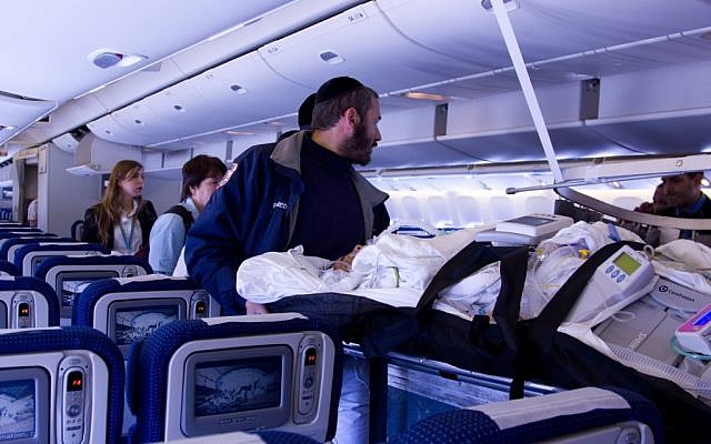 Sima Avishar is wheeled onto the plane en route to Israel (photo credit: vitalone.org)