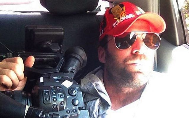This undated family photo released on Thursday shows Timothy Tracy inside a vehicle in Venezuela (photo credit: AP/Courtesy of family) This undated family photo released on Thursday shows Timothy Tracy inside a vehicle in Venezuela (photo credit: AP/Courtesy of family)