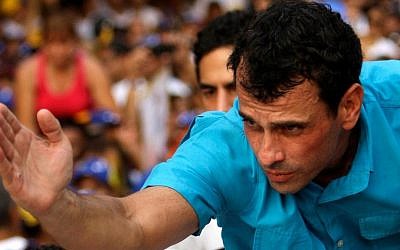 Opposition presidential candidate Henrique Capriles, the Catholic grandson of Holocaust survivors, greets supporters as he campaigns in Maracay, Venezuela, on Thursday. (photo credit: AP Photo/Fernando Llano)