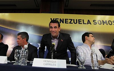 Venezuelan presidential candidate Henrique Capriles, center, at a news conference in Caracas, Venezuela, on Monday, April 1, 2013. (photo credit: Fernando Llano/AP)