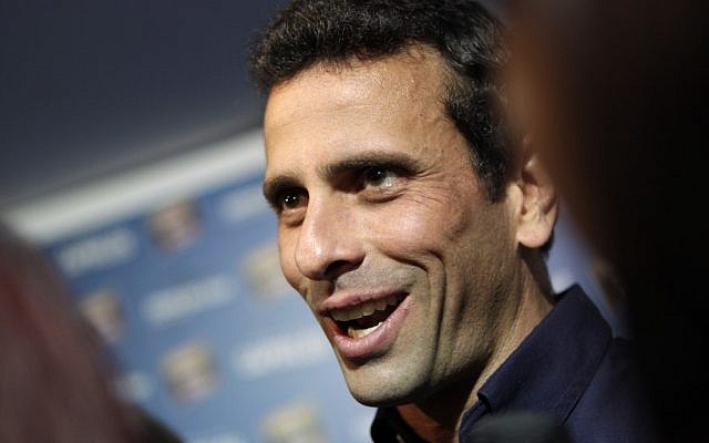 Opposition leader Henrique Capriles Radonski smiles after a press conference in Caracas, Venezuela, late Thursday (photo credit: AP/Ariana Cubillos) Opposition leader Henrique Capriles Radonski smiles after a press conference in Caracas, Venezuela, late Thursday (photo credit: AP/Ariana Cubillos)