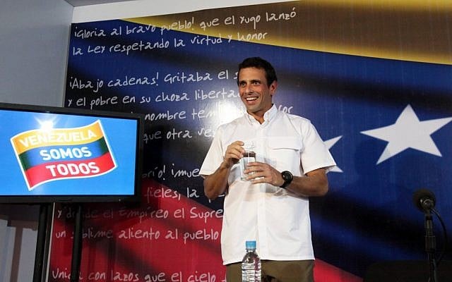 Venezuela's opposition leader Henrique Capriles Radonski arrives for a news conference at his office in Caracas, Venezuela, on Wednesday. (photo credit: AP/Fernando Llano) Venezuela's opposition leader Henrique Capriles Radonski arrives for a news conference at his office in Caracas, Venezuela, on Wednesday. (photo credit: AP/Fernando Llano)