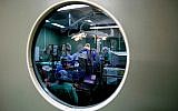 Surgeons and nurses performing surgery in an Israeli hospital on January 15. 2007. (photo credit: Nati Shohat /Flash90)