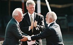 US President Bill Clinton, Israeli Prime Minister Yitzhak Rabin, King Hussein of Jordan at the peace treaty signing ceremony in the Arava Desert, October 1994. (Nati Shohat/Flash90)