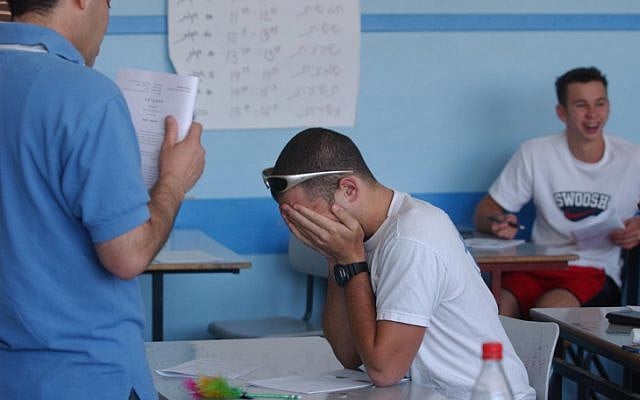 Students taking their matriculation exams in a classroom on March 06, 2004 (photo credit: Flash90) Students taking their matriculation exams in a classroom on March 06, 2004 (photo credit: Flash90)