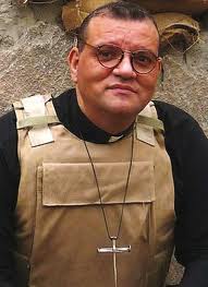 Andrew White in Baghdad, as seen on the cover of his 2009 book 'Faith under fire' (photo credit: Courtesy) Andrew White in Baghdad, as seen on the cover of his 2009 book 'Faith under fire' (photo credit: Courtesy)
