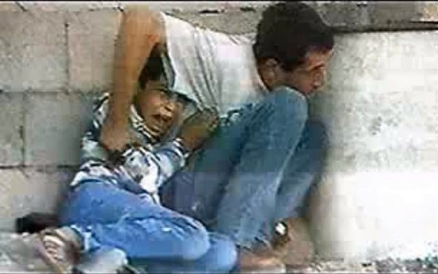 A screen capture of the video showing the Muhammad al-Durra incident. (Image capture from YouTube)