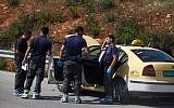 FILE: Israeli security forces inspect the site of a terror attack at a bus stop at the Tapuah junction in the northern West Bank, Tuesday, April 30, 2013 (photo credit: Flash90)