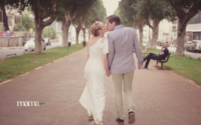 Newlyweds stroll down Tel Aviv's Rothschild Boulevard (photo credit: Mama Photography)