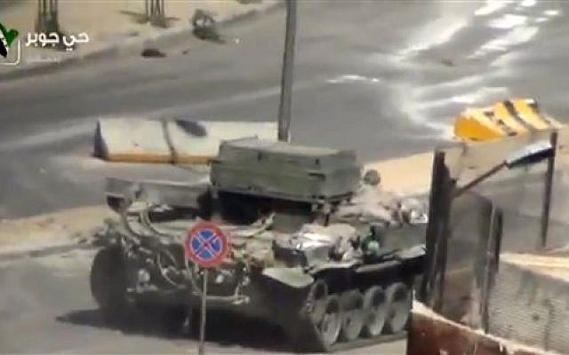 A Syrian Army tank in the streets of the Jobar district of Damascus, Syria, Friday, April 26, 2013 (photo credit: AP Photo/Ugarit via AP video) A Syrian Army tank in the streets of the Jobar district of Damascus, Syria, Friday, April 26, 2013 (photo credit: AP Photo/Ugarit via AP video)