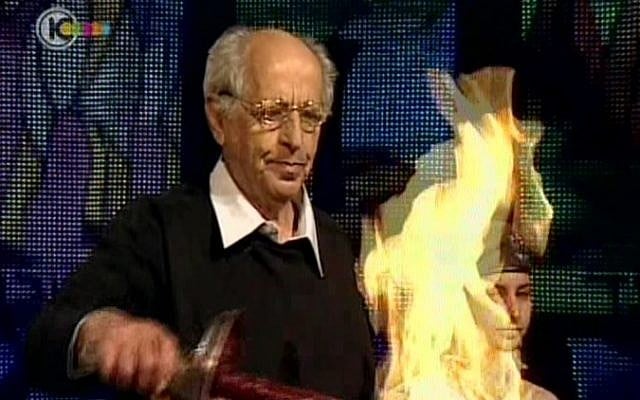 Muki Tzur lights the first torch at Monday night's Independence Day ceremony at Mt. Herzl in Jerusalem. (photo credit: image capture Channel 10)