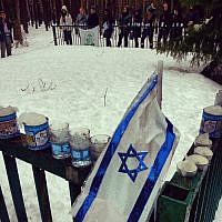 Flag and memorial candles in Lupachowo forest (photo: courtesy) Flag and memorial candles in Lupachowo forest (photo: courtesy)