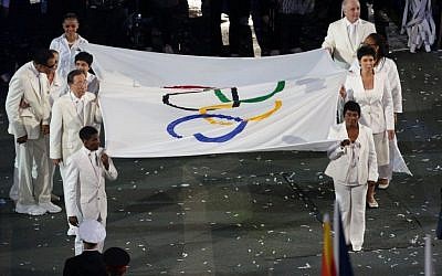 Opening ceremony of the London Olympic Games, 2012. Sally Becker, opposite UN Secretary-General Ban Ki-moon, is one of the flag bearers. (photo credit: courtesy)