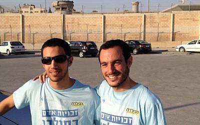 Matan Asher, right, and Alon Begin at the Qalandiya checkpoint, April 30 (photo credit: Elhanan Miller/Times of Israel)