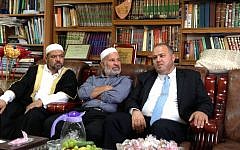 Sheikh Omar Kayal, imam of the Bilal mosque (right), sits with Israeli Muslim clerics at a reception for French Imam Hassen Chalghoumi in Majd Al-Krum, May 29 (photo credit: Elhanan Miller/Times of Israel)