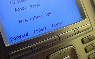 The screen on the phone console at the reception desk at The Associated Press Washington bureau, Monday, May 13 (photo credit: AP/Jon Elswick)