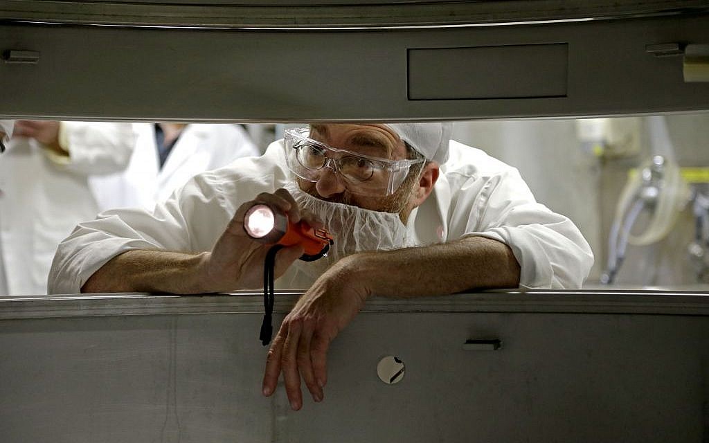 Rabbi Pinchas Herman inspects machinery used for enzyme production for kosher products at Novozymes North America Inc., in Franklinton, NC. (photo credit: AP Photo/Gerry Broome) Rabbi Pinchas Herman inspects machinery used for enzyme production for kosher products at Novozymes North America Inc., in Franklinton, NC. (photo credit: AP Photo/Gerry Broome)