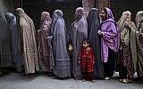 Illustrative: Pakistani women at a polling station on the outskirts of Islamabad, Pakistan, May 2013. (AP Photo/Muhammed Muheisen)