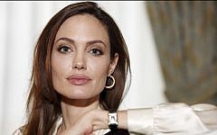 Actress Angelina Jolie authored an op-ed for Tuesday’s May 14, 2013, New York Times, where she writes that in April she finished three months of surgical procedures to remove both breasts as a preventive measure. (photo credit: AP/Carlo Allegri, File)