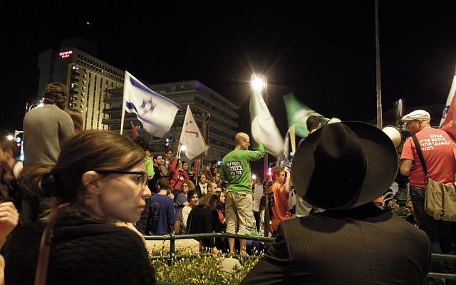 Secular and ultra-Orthodox residents of Jerusalem stand side by side at a protest in Jerusalem against the impending budget cuts proposed by Finance Minister Yair Lapid, Saturday May 11. (photo credit: Yifa Yaakov/The Times of Israel) Secular and ultra-Orthodox residents of Jerusalem stand side by side at a protest in Jerusalem against the impending budget cuts proposed by Finance Minister Yair Lapid, Saturday May 11. (photo credit: Yifa Yaakov/The Times of Israel)