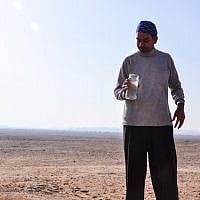 Swadesh Sharma prepares to demonstrate a kriya by drinking saline water (photo credit: Michal Shmulovich)