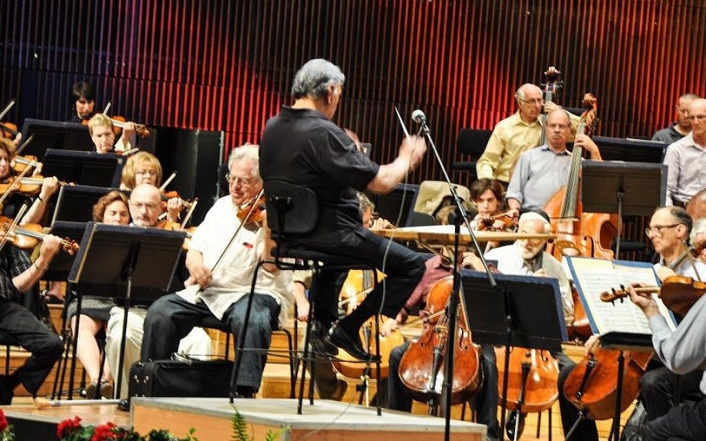 The Israel Philharmonic rehearses Friday for upcoming celebratory concerts marking its return to its newly renovated home, with conductor Zubin Mehta, center, and Itzhak Perlman, playing the violin to his left (photo credit: Michal Shmulovich/Times of Israel) The Israel Philharmonic rehearses Friday for upcoming celebratory concerts marking its return to its newly renovated home, with conductor Zubin Mehta, center, and Itzhak Perlman, playing the violin to his left (photo credit: Michal Shmulovich/Times of Israel)