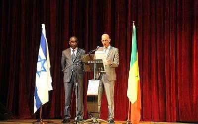 Israel's ambassador to Senegal, Eli Ben-Tura, and Senegalese government minister Mamadou Talla speaking at an Israel Independence Day celebration at Dakar's grand theater, April 30, 2013. (photo credit: Cnaan Liphshiz/JTA)