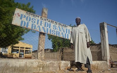 Dougoutigo Fadiga outside the Bani Israel clinic near the Senegalese village's sacred tree, May 2013. (photo credit: Cnaan Liphshiz/JTA)