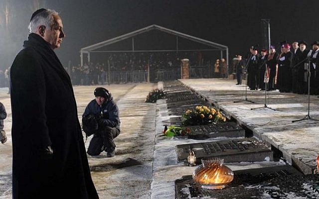 Prime Minister Benjamin Netanyahu lays a wreath at a memorial ceremony marking the 65th anniversary of the liberation of Auschwitz camp and to honour the victims of the Holocaust, in Auschwitz Birkenau, Poland, on International Holocaust Memorial Day. January 27, 2010. (photo credit: Avi Ohayon/Government Press Office/Flash90) Prime Minister Benjamin Netanyahu lays a wreath at a memorial ceremony marking the 65th anniversary of the liberation of Auschwitz camp and to honour the victims of the Holocaust, in Auschwitz Birkenau, Poland, on International Holocaust Memorial Day. January 27, 2010. (photo credit: Avi Ohayon/Government Press Office/Flash90)